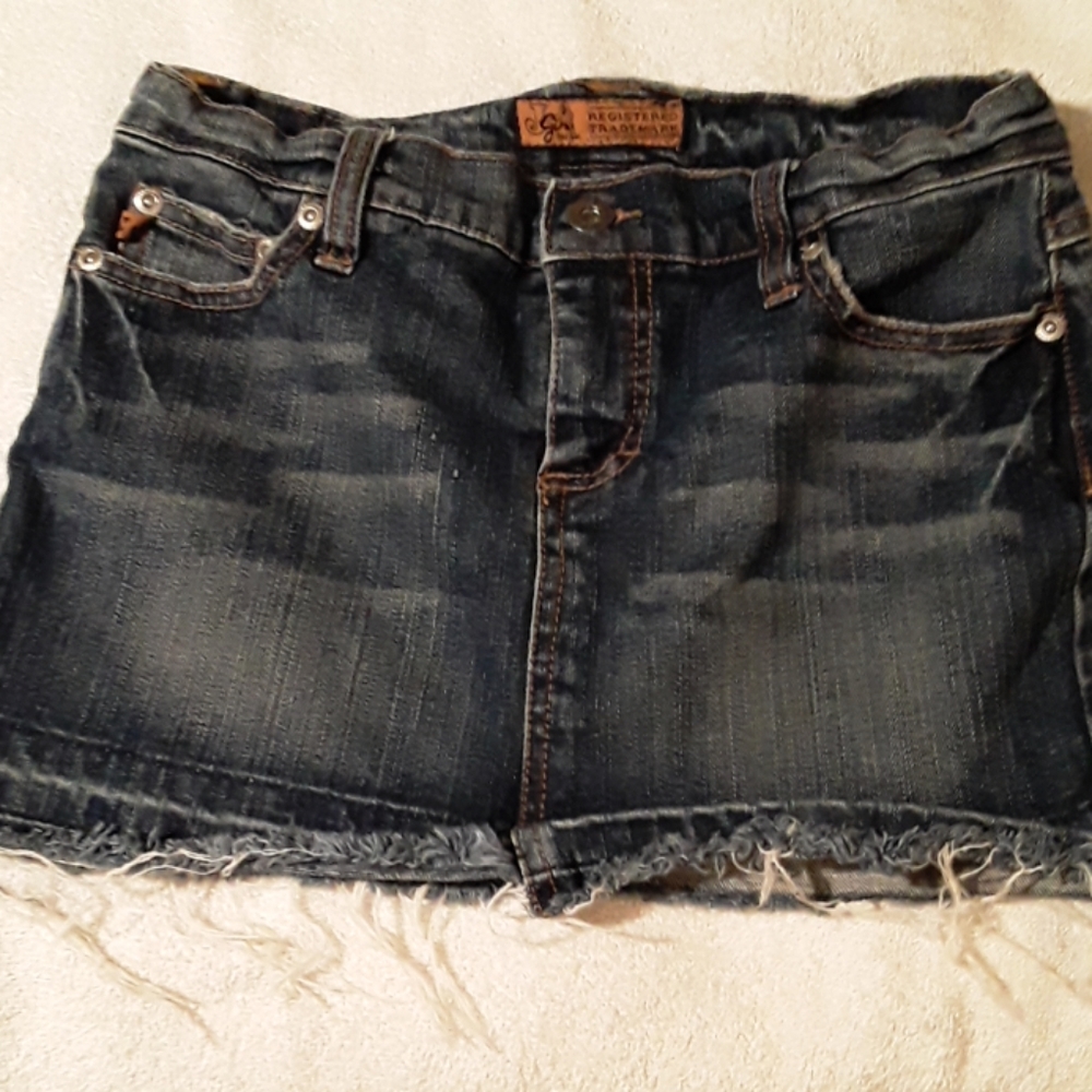Distressed jean skirt.